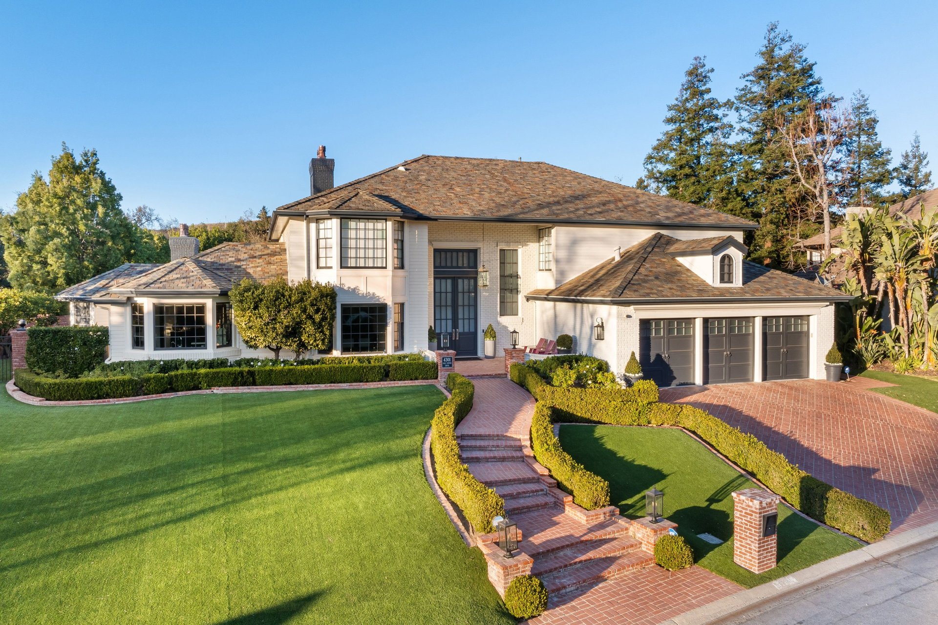 Beautiful landscaped property with manicured lawn